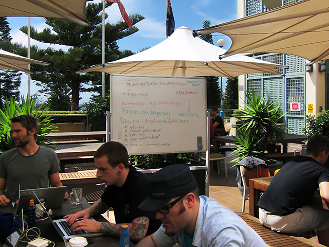 Twig sprint at DrupalCon Sydney on the patio with a whiteboard